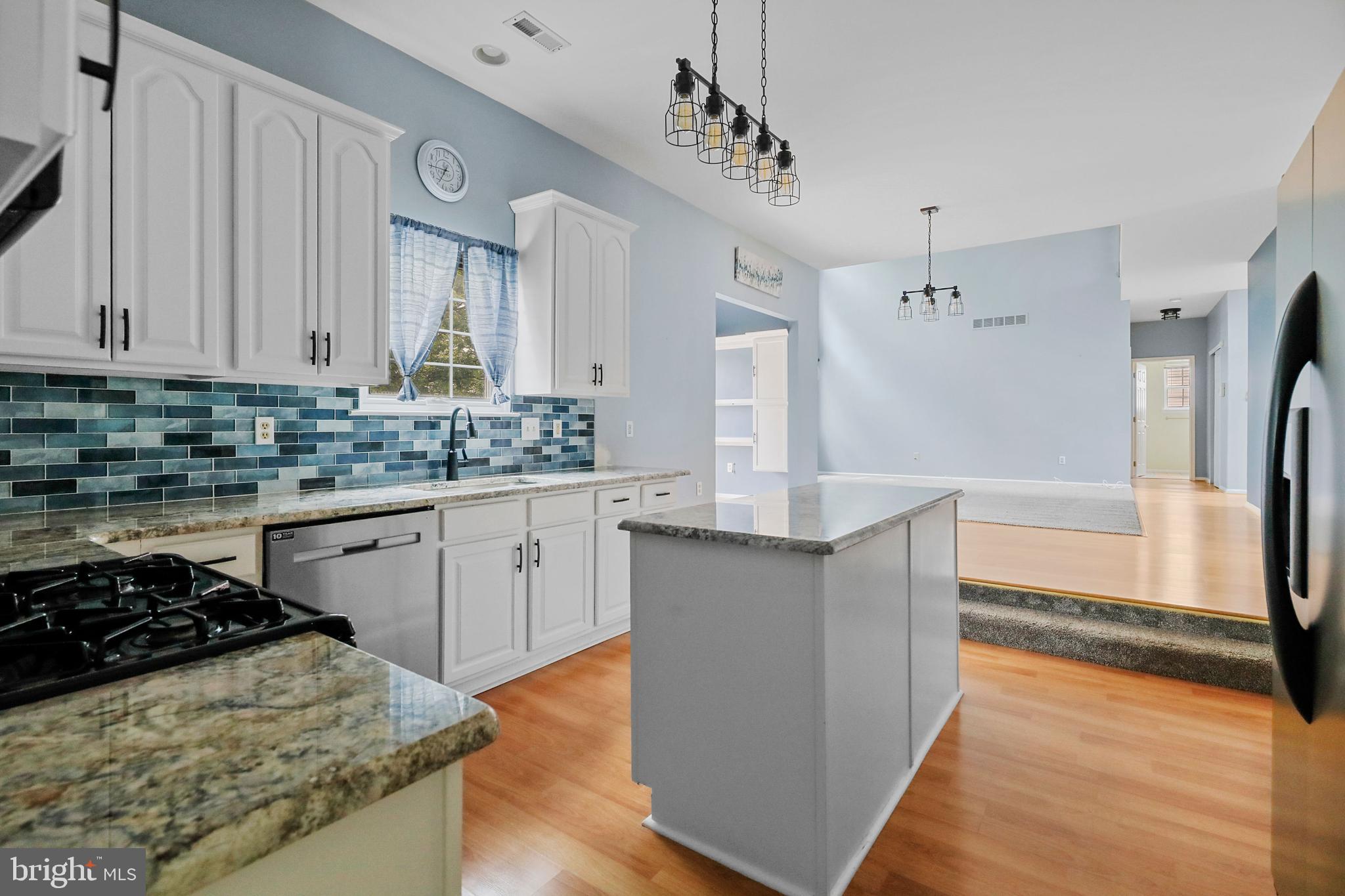 19 Pear Tree Place Sewell, NJ 08080 - Photo 10 of 47 a kitchen with stainless steel appliances granite countertop a sink stove and refrigerator