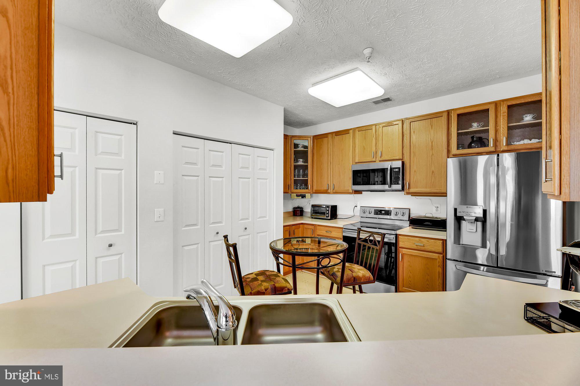 6 Brook Farm Court, Unit E Perry Hall, MD 21128 - Photo 14 of 41 Pass through to the kitchen will accommodate stool