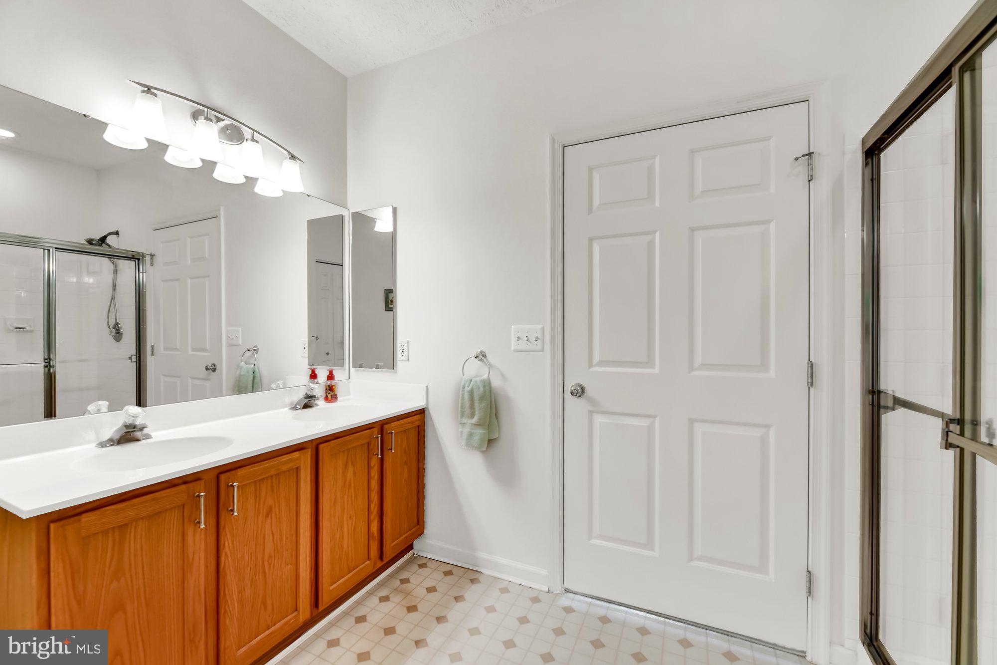 6 Brook Farm Court, Unit E Perry Hall, MD 21128 - Photo 25 of 41 Primary Bath w/dual vanities & walk-in shower.