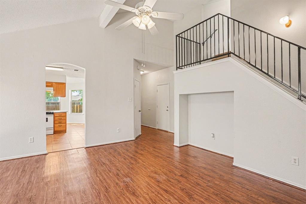 2541 Rivers Edge Drive Fort Worth, TX 76118 - Photo 6 of 31 wooden floor in an empty room with a window