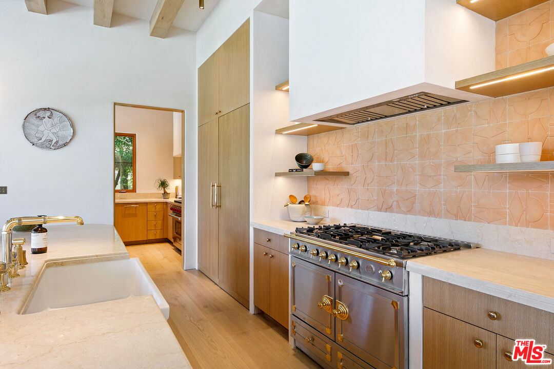 6902 Wildlife Road Malibu, CA 90265 - Photo 11 of 41 a kitchen with a stove and a refrigerator