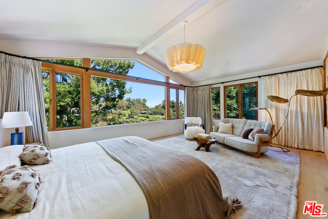 6902 Wildlife Road Malibu, CA 90265 - Photo 18 of 41 a bedroom with a bed and a large window
