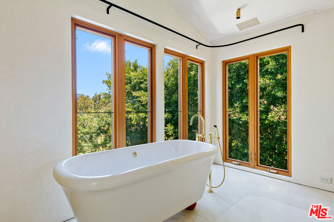 6902 Wildlife Road Malibu, CA 90265 - Photo 21 of 41 a white bath tub sitting in front of a window