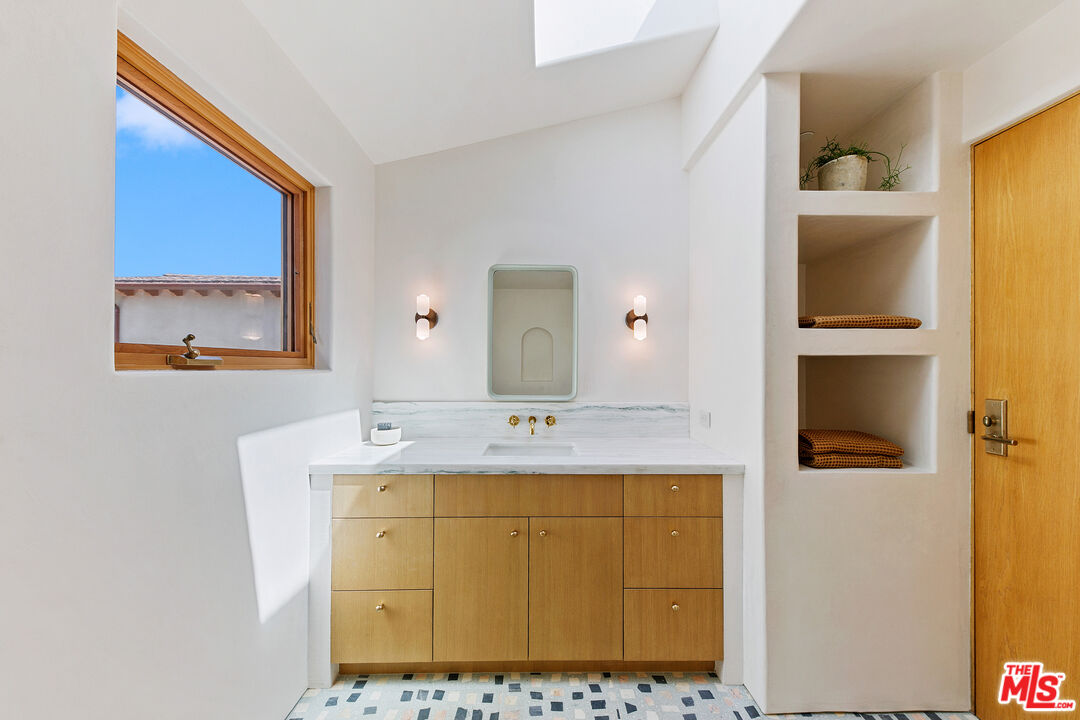 6902 Wildlife Road Malibu, CA 90265 - Photo 27 of 41 a bathroom with a sink and a mirror