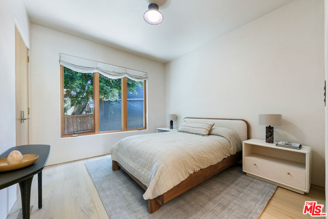 6902 Wildlife Road Malibu, CA 90265 - Photo 28 of 41 a bedroom with a bed and a window