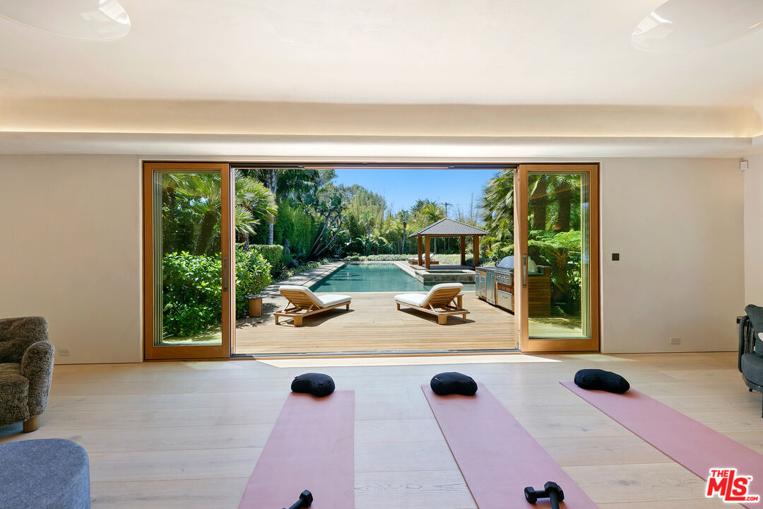 6902 Wildlife Road Malibu, CA 90265 - Photo 30 of 41 a view of swimming pool from a living room