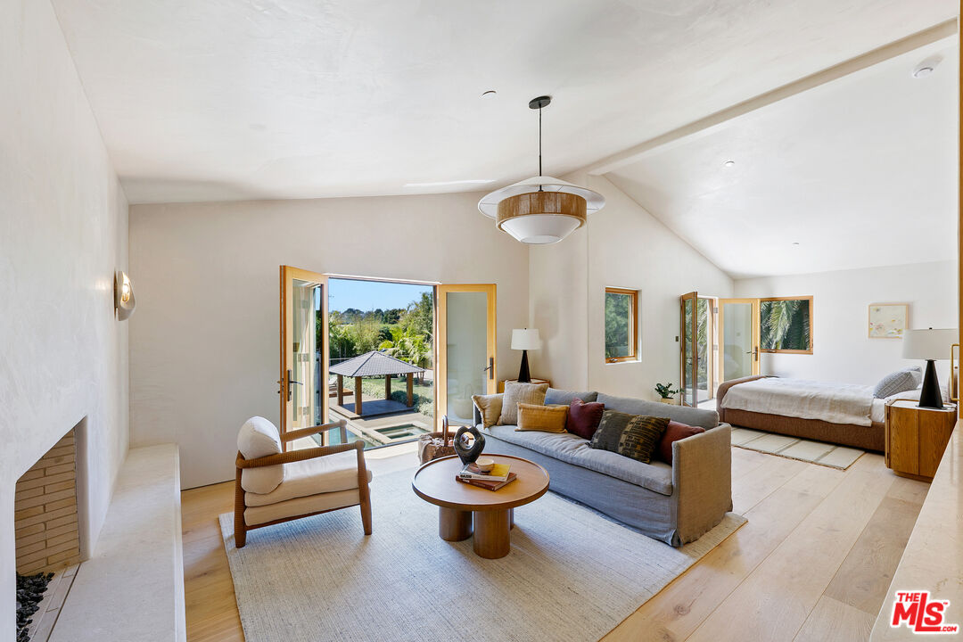6902 Wildlife Road Malibu, CA 90265 - Photo 32 of 41 a living room with furniture and a wooden floor