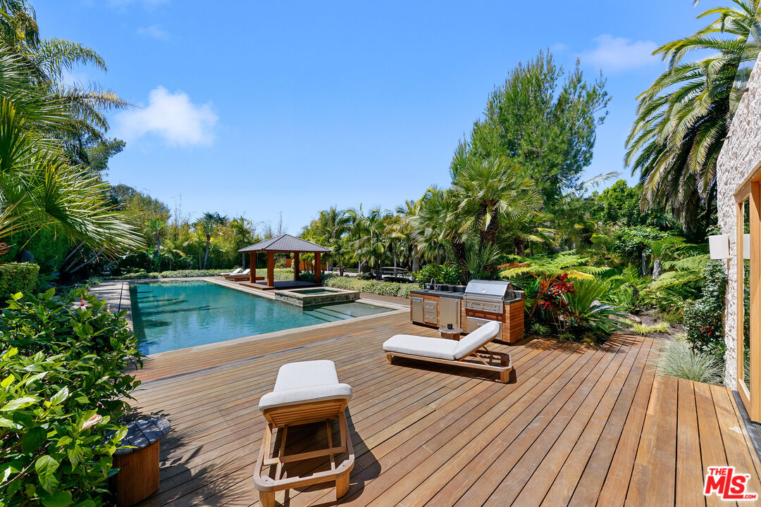 6902 Wildlife Road Malibu, CA 90265 - Photo 35 of 41 a view of a swimming pool with lounge chair