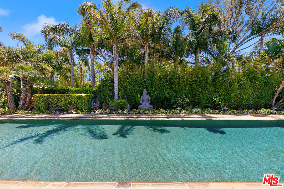 6902 Wildlife Road Malibu, CA 90265 - Photo 36 of 41 a view of backyard with swimming pool and green space