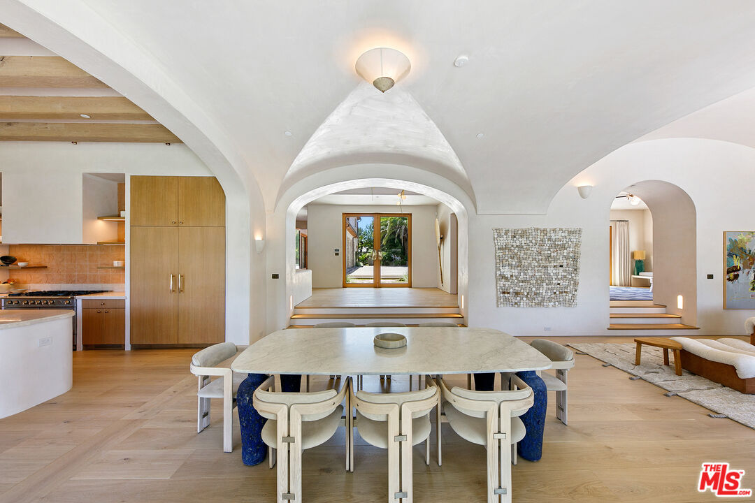 6902 Wildlife Road Malibu, CA 90265 - Photo 7 of 41 a view of a dining room with furniture and a large window