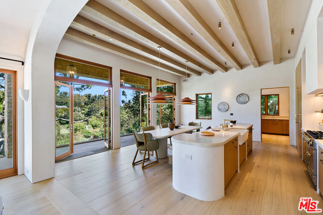 6902 Wildlife Road Malibu, CA 90265 - Photo 8 of 41 a living room with furniture and a large window