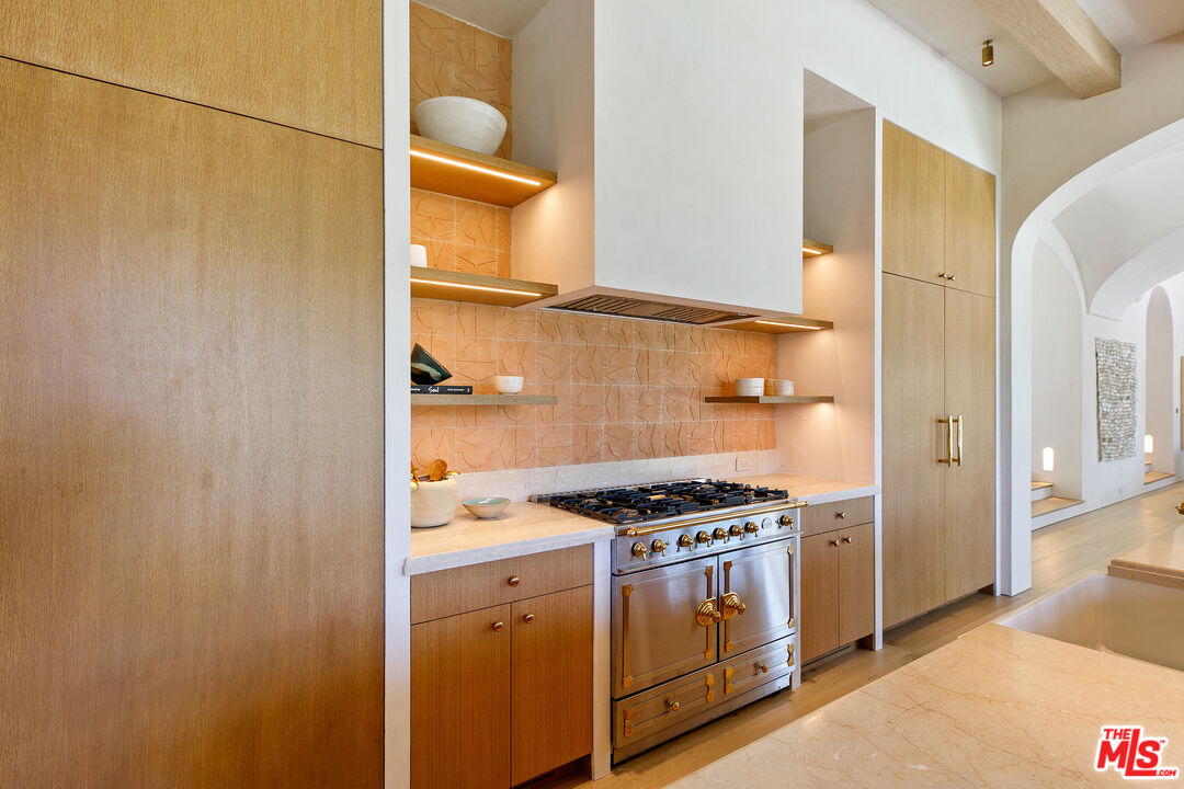 6902 Wildlife Road Malibu, CA 90265 - Photo 10 of 41 a kitchen with a stove and a refrigerator
