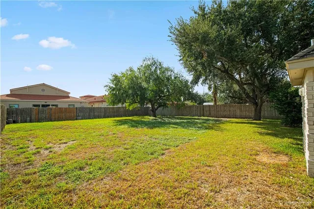 a view of a swimming pool and a yard