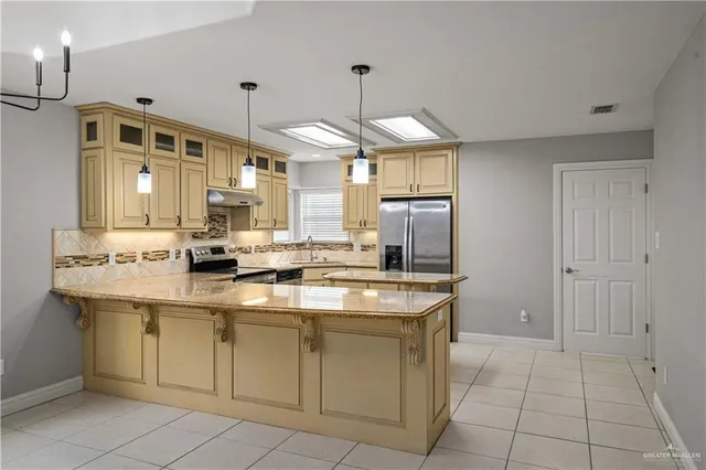 a kitchen with a sink counter top space and cabinets