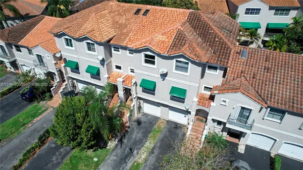 an aerial view of residential houses with outdoor space