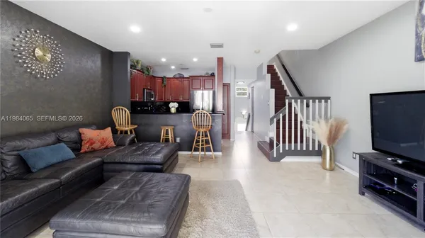 a living room with furniture and a flat screen tv