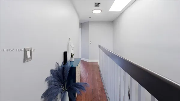 a view of entryway with wooden floor