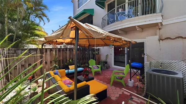 a view of a chairs and table in the patio
