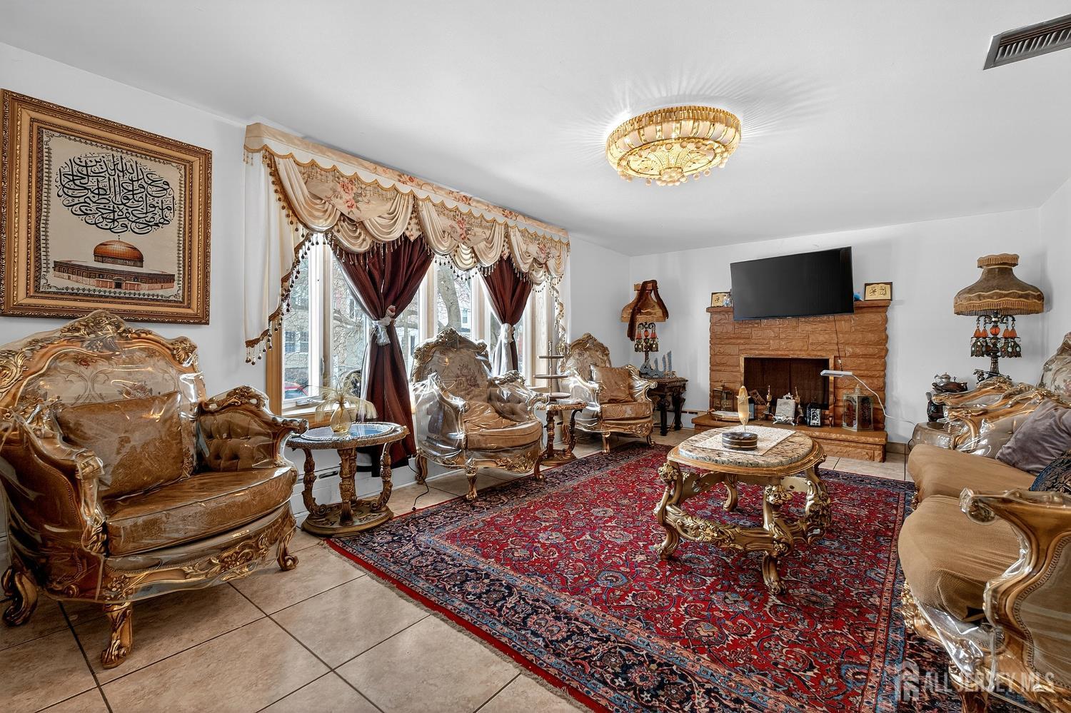 6 East 2nd Street Port Reading, NJ 07064 - Photo 1 of 40 a living room with furniture and a fireplace
