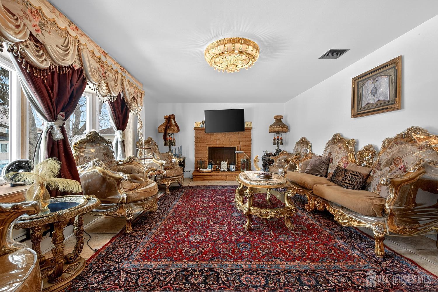6 East 2nd Street Port Reading, NJ 07064 - Photo 2 of 40 a living room with furniture fireplace and a flat screen tv