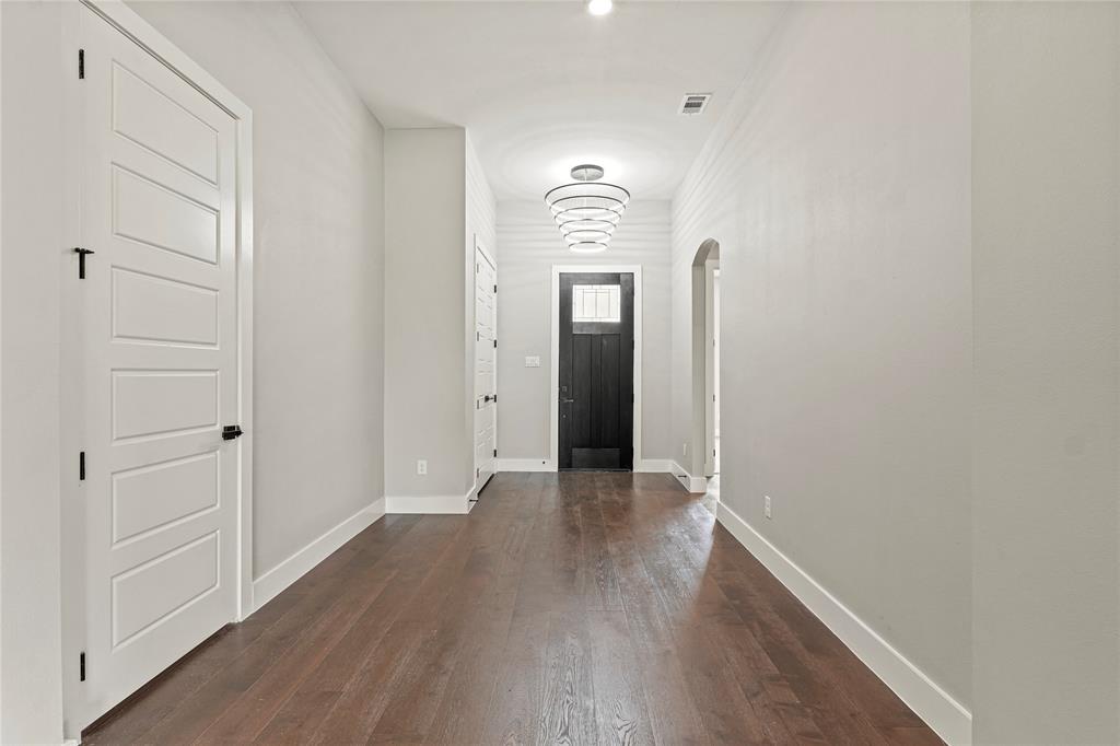 38093 Misty Ridge Drive Whitney, TX 76692 - Photo 2 of 25 a view of a hallway with wooden floor