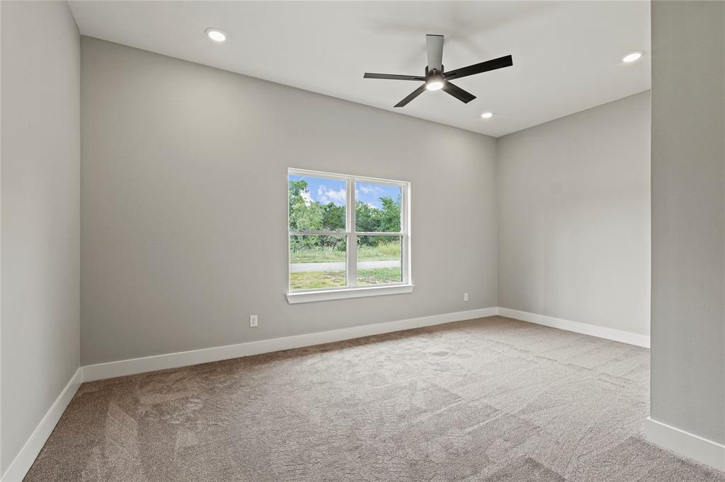 38093 Misty Ridge Drive Whitney, TX 76692 - Photo 23 of 25 a view of a livingroom with a ceiling fan and window