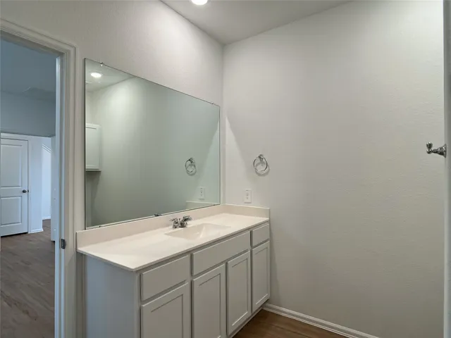 a bathroom with a shower a toilet and a window