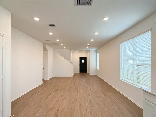 a kitchen with cabinets and stainless steel appliances