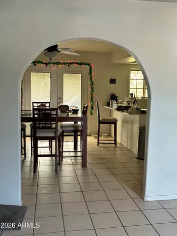 a dining room with furniture and window