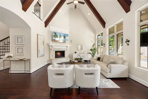 a kitchen with granite countertop a sink a stove oven and wooden floors