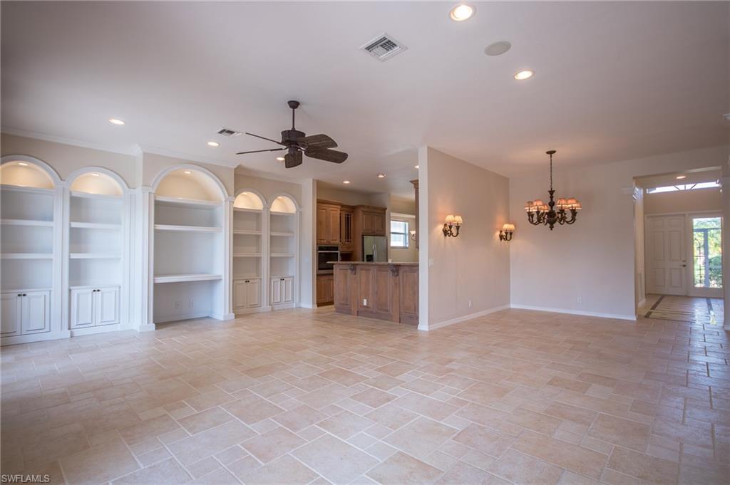 9337 Springview Loop Estero, FL 33928 - Photo 17 of 25 a view of a big room with a chandelier fan and windows