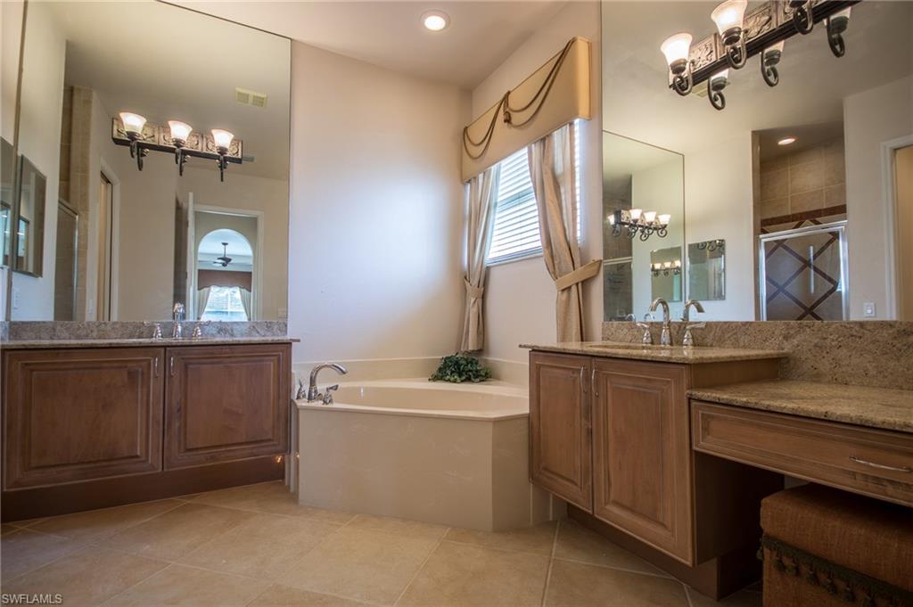 9337 Springview Loop Estero, FL 33928 - Photo 21 of 25 a bathroom with a sink double vanity