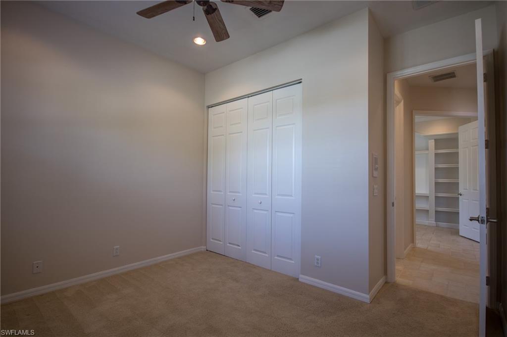 9337 Springview Loop Estero, FL 33928 - Photo 8 of 25 an empty room with a empty space and chandelier fan