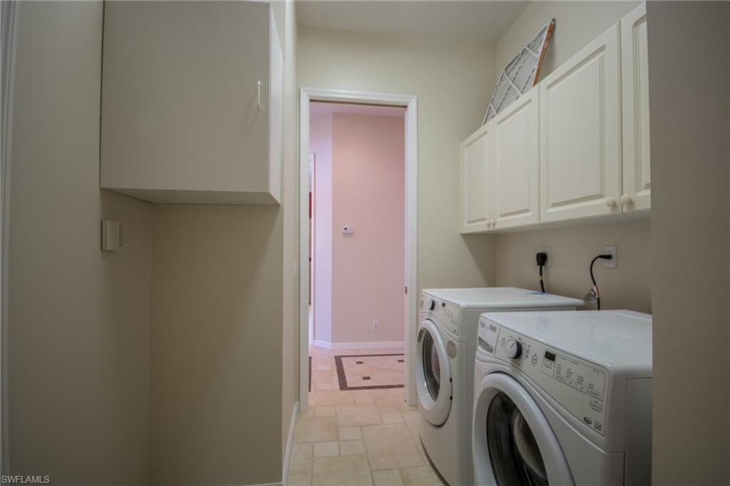 9337 Springview Loop Estero, FL 33928 - Photo 9 of 25 a utility room with dryer and washer