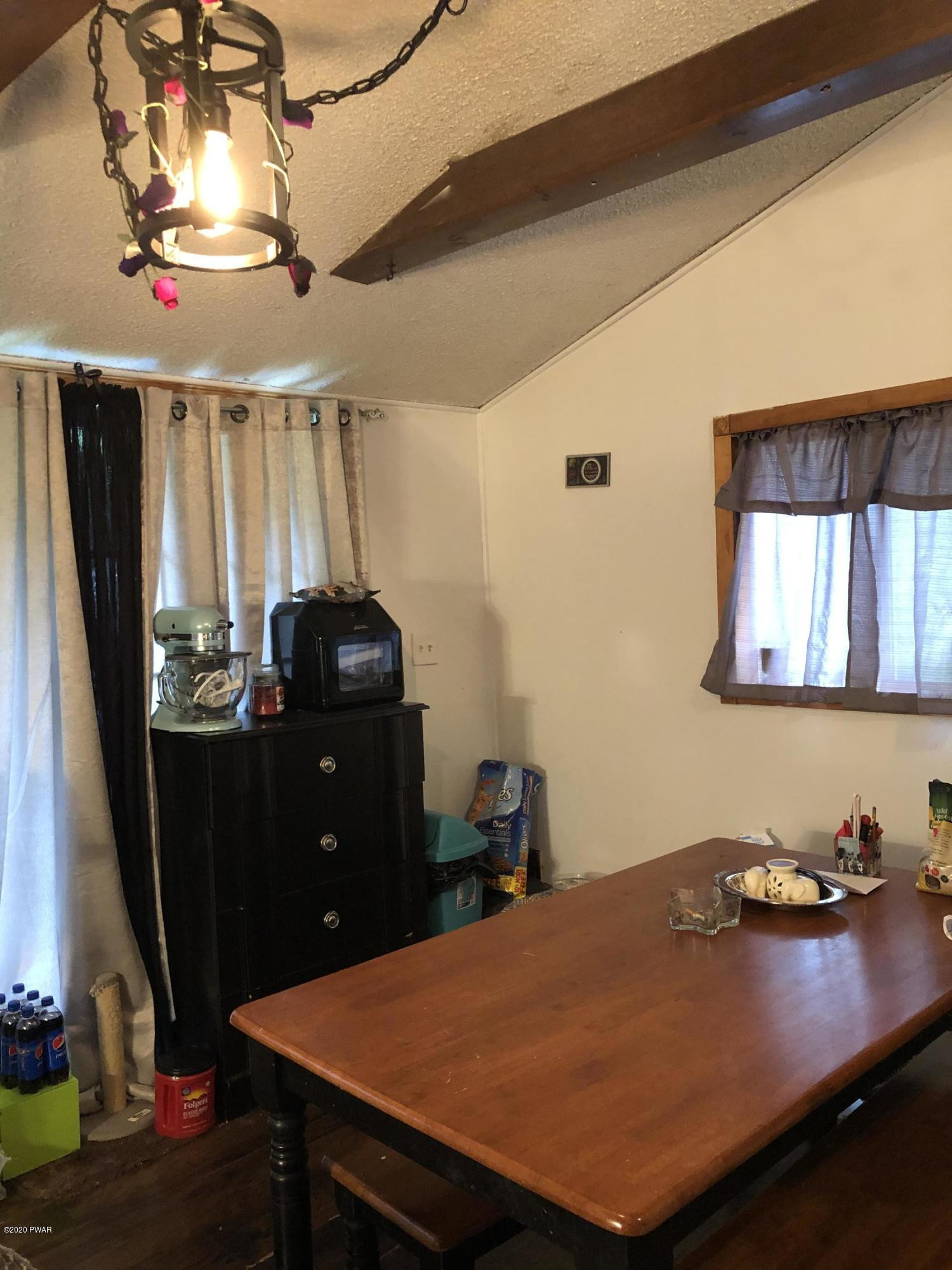 177 Skyview Road Dingmans Ferry, PA 18328 - Photo 7 of 18 a room with furniture and window
