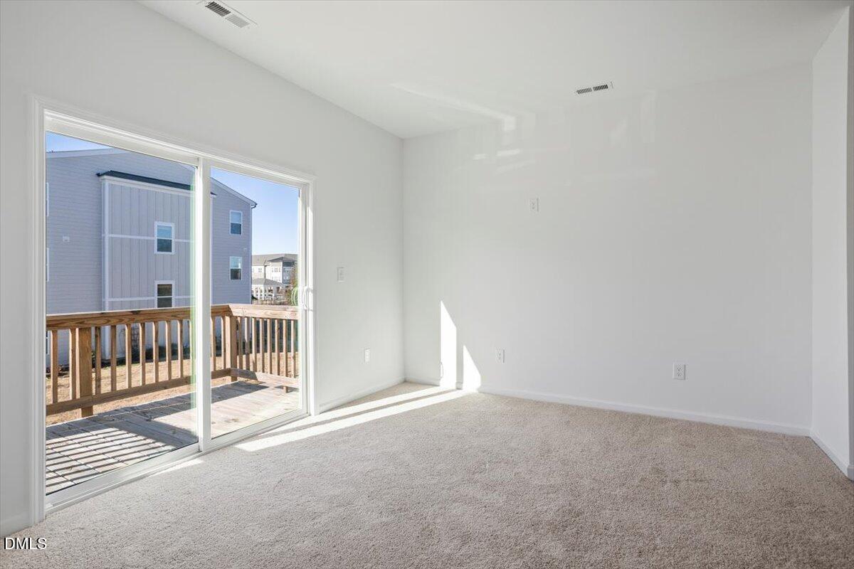 443 North Fisher Street Raleigh, NC 27610 - Photo 12 of 33 a view of a room with wooden floor and fence