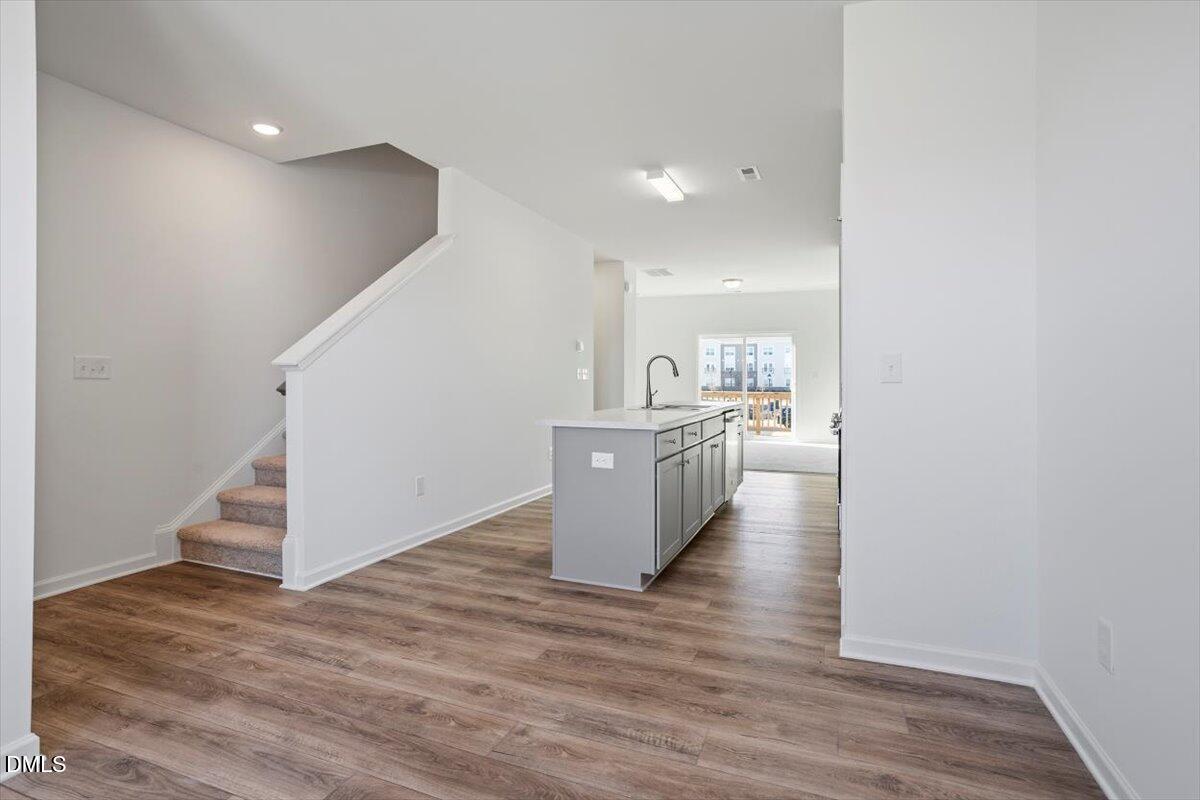 443 North Fisher Street Raleigh, NC 27610 - Photo 20 of 33 a view of a kitchen and wooden floor