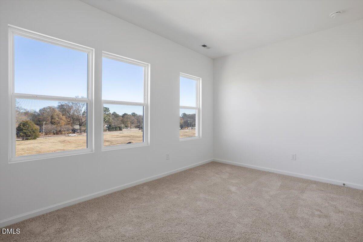443 North Fisher Street Raleigh, NC 27610 - Photo 22 of 33 an empty room with a window