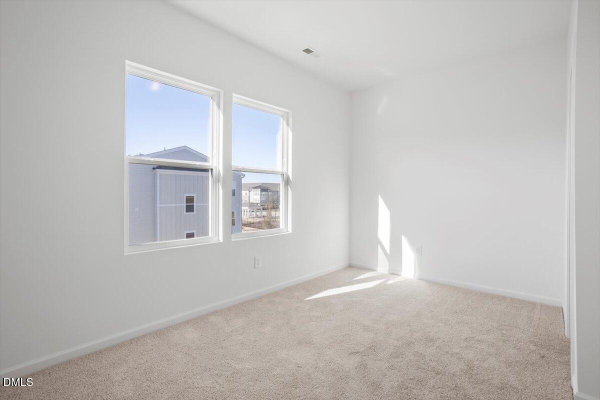 443 North Fisher Street Raleigh, NC 27610 - Photo 24 of 33 a view of empty room with windows