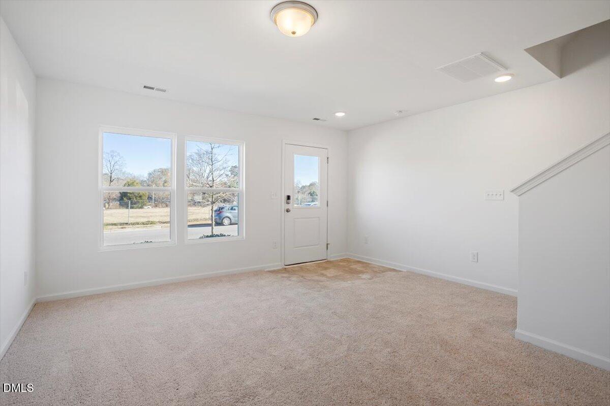 443 North Fisher Street Raleigh, NC 27610 - Photo 6 of 33 an empty room with windows