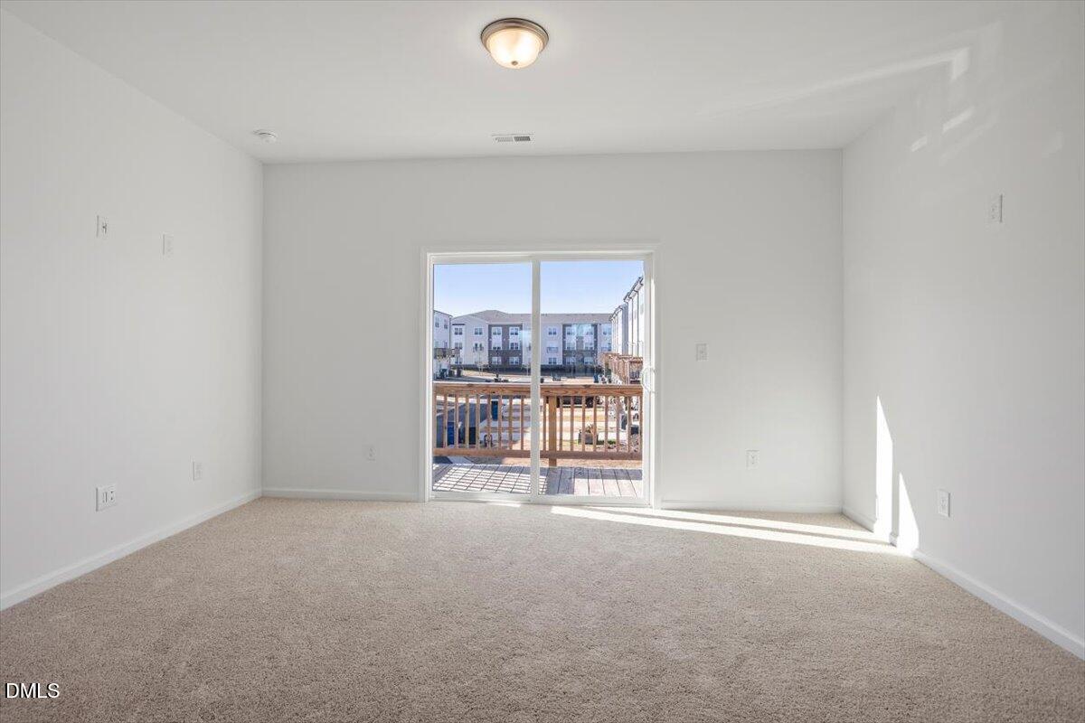 443 North Fisher Street Raleigh, NC 27610 - Photo 8 of 33 an empty room with a fireplace