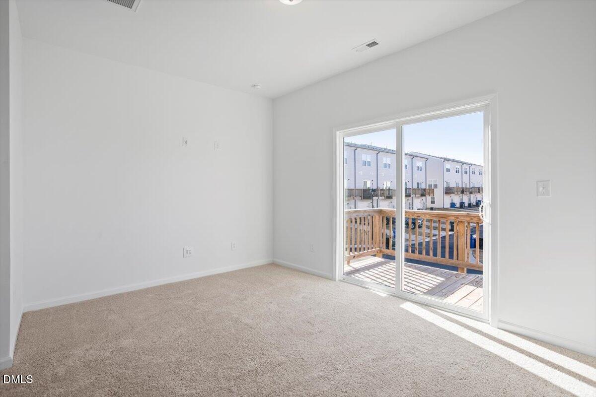 443 North Fisher Street Raleigh, NC 27610 - Photo 9 of 33 a view of an empty room with a window