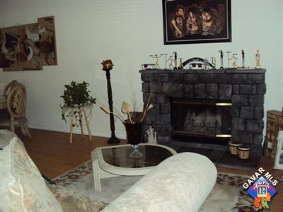 42339 Blossom Drive Lancaster, CA 93536 - Photo 2 of 8 a living room with furniture and a fireplace