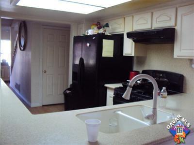 42339 Blossom Drive Lancaster, CA 93536 - Photo 5 of 8 a kitchen with a refrigerator and a stove