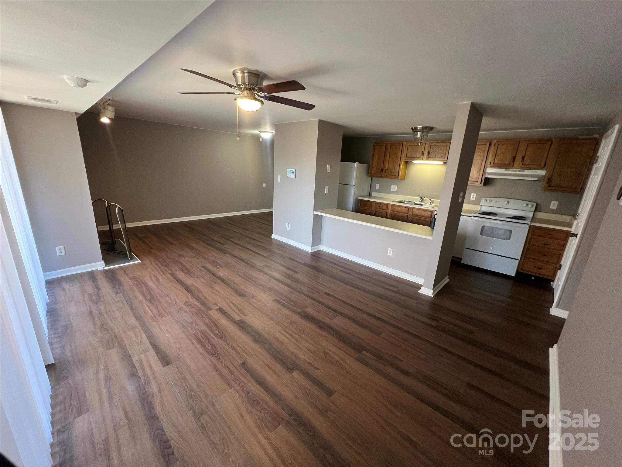 9401 Old Concord Road, Unit K Charlotte, NC 28213 - Photo 2 of 12 a view of a living room with hardwood floor