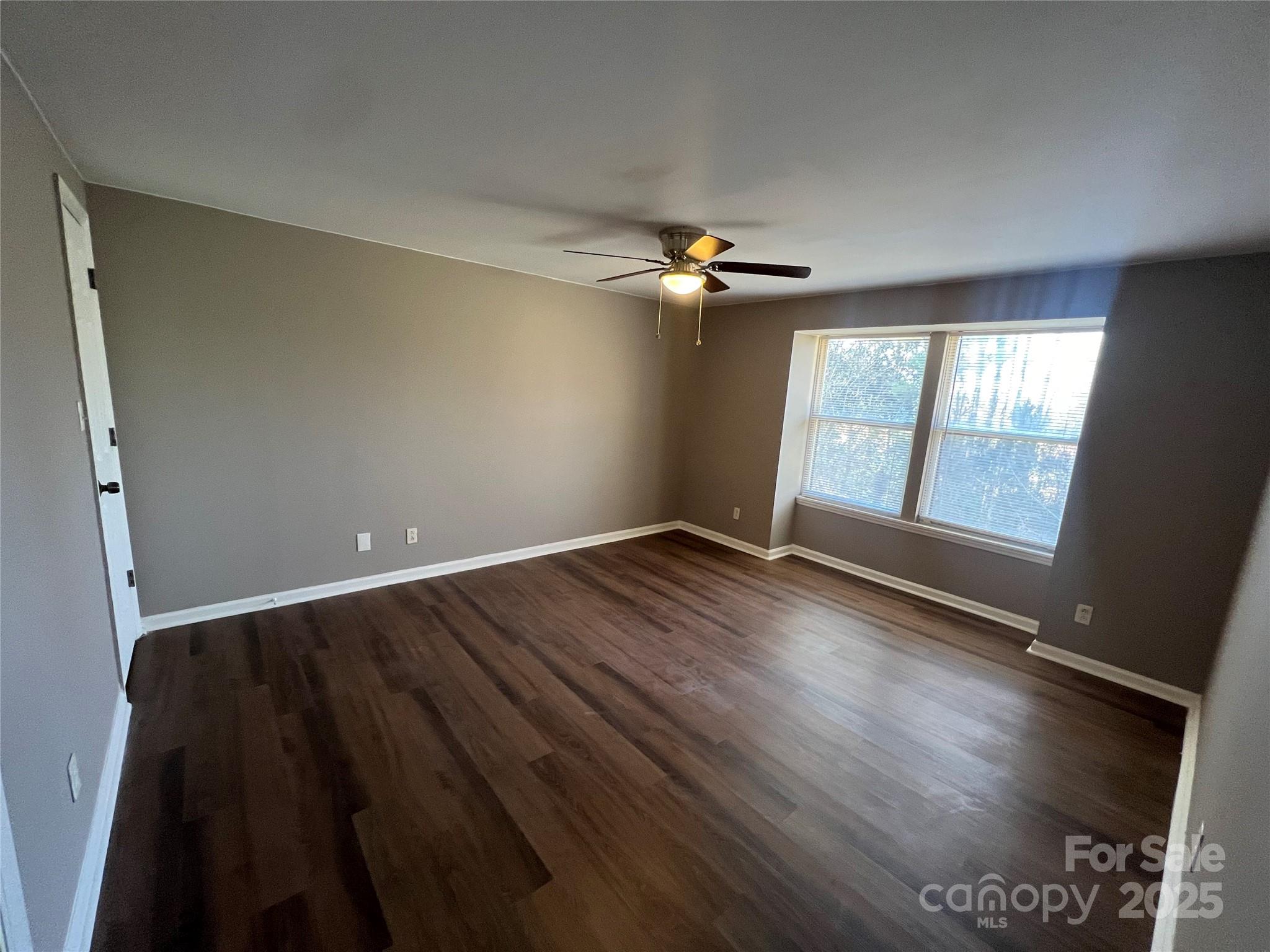 9401 Old Concord Road, Unit K Charlotte, NC 28213 - Photo 7 of 12 wooden floor in an empty room with a window