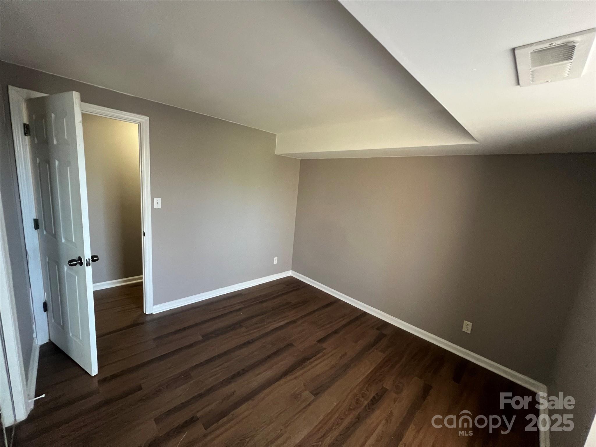 9401 Old Concord Road, Unit K Charlotte, NC 28213 - Photo 10 of 12 wooden floor in an empty room