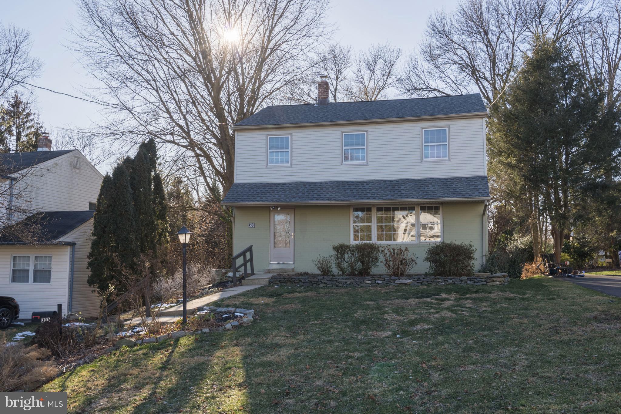 303 Highland Road Cheltenham, PA 19012 - Photo 25 of 25 a front view of a house with a yard and garage