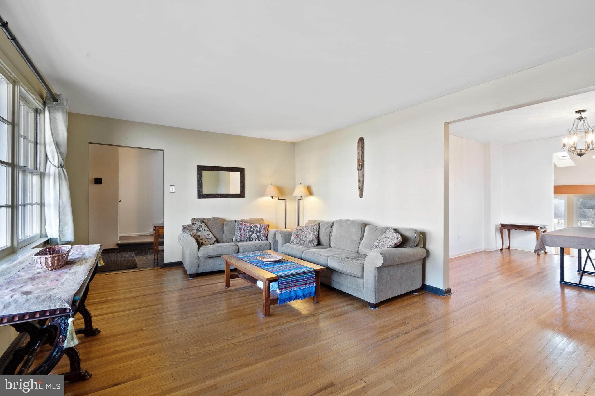 303 Highland Road Cheltenham, PA 19012 - Photo 3 of 25 a living room with furniture and a wooden floor