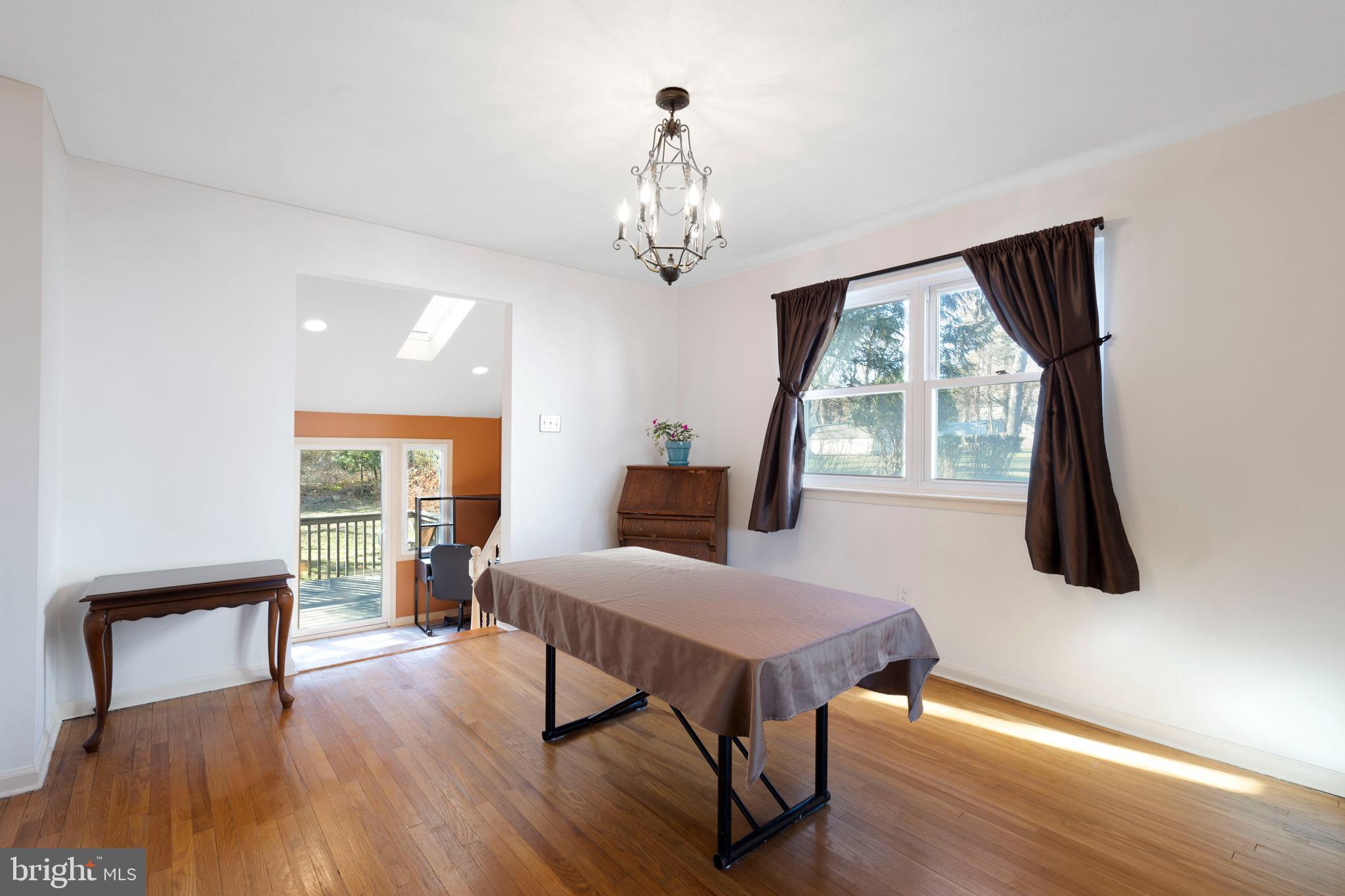 303 Highland Road Cheltenham, PA 19012 - Photo 4 of 25 a bedroom with furniture and a window
